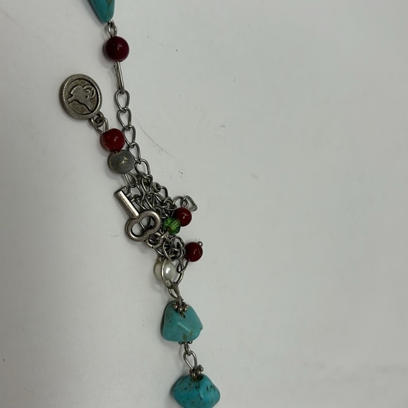 Fatima's hand bracelet with silver-colored turquoise stones and red Stones. - Picture 3 of 6